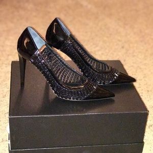 Black patent leather pumps. Made in Italy.